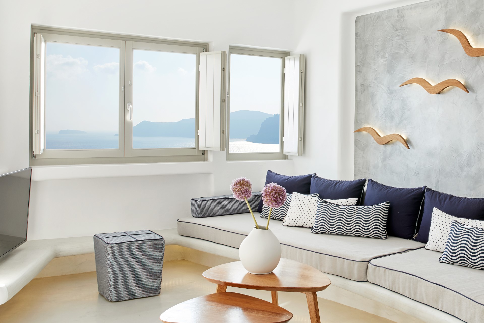 Senior Villa living room at La Perla with a view of the Santorini caldera